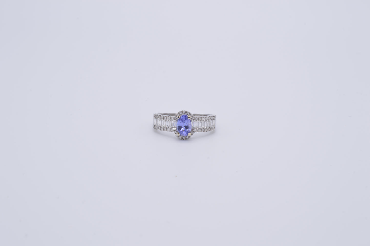 tanzanite oval cut and baguette diamond cluster ring