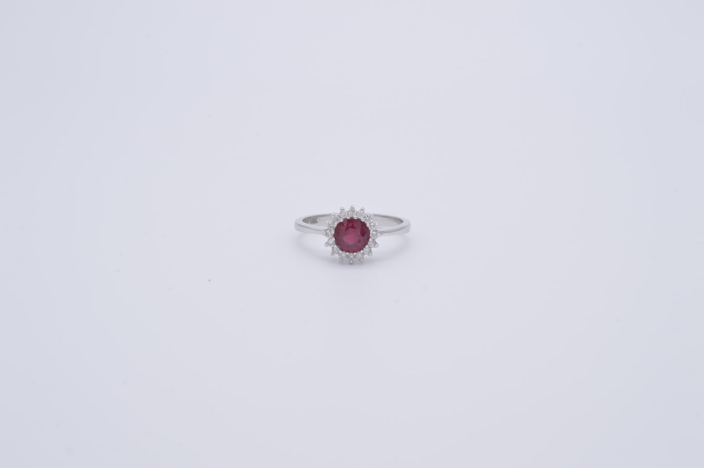 round ruby , diamond and white gold ring