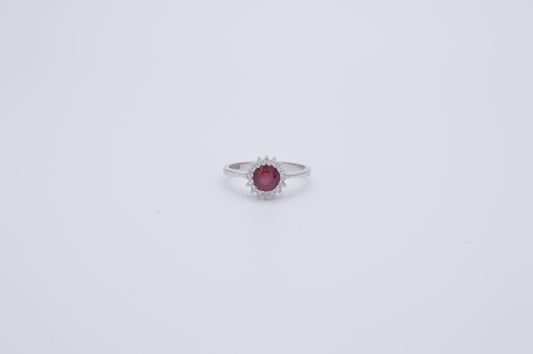 round ruby , diamond and white gold ring