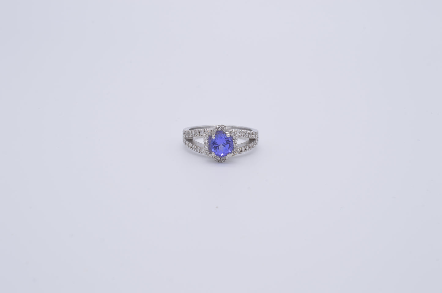 tanzanite round cut and diamond cluster ring